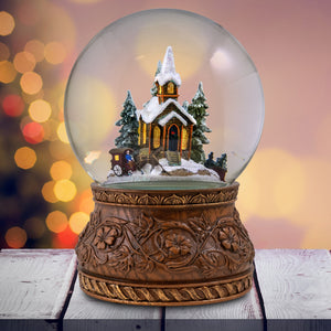 Rotating Carriage at the Village Church Snow Globe