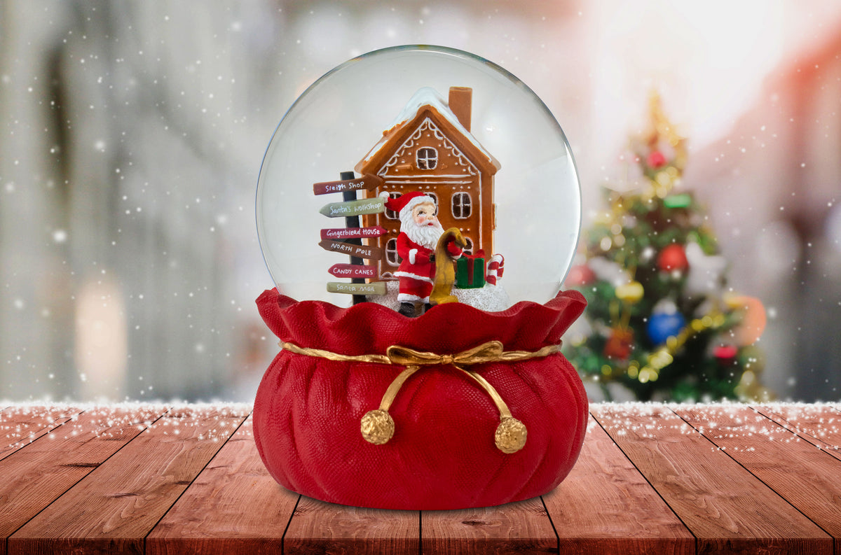Santa Checking His List Christmas Snow Globe