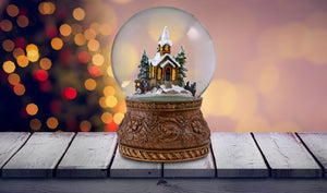 Rotating Carriage at the Village Church Snow Globe