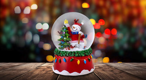 Snowman Topping the Tree with Cardinals Musical Snow Globe